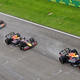 A photo of the two Red Bull F1 cars being followed by a Ferrari and McLaren.